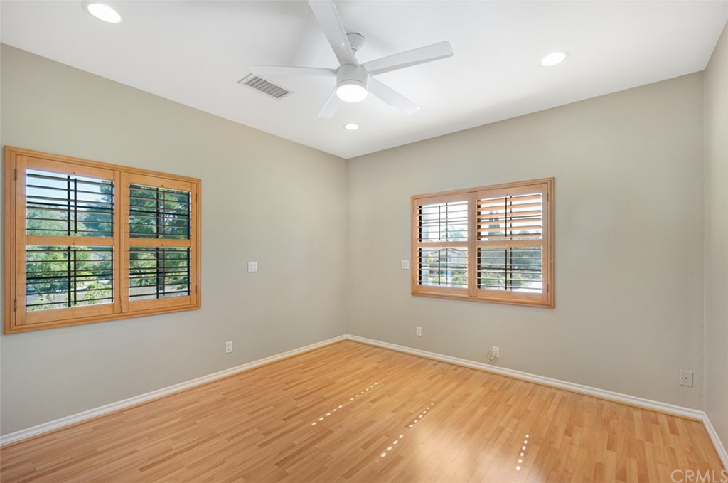3724 Cedar Vale Way Fallbrook, CA 92028 - Photo 37 of 39 a view of an empty room with wooden floor and a window