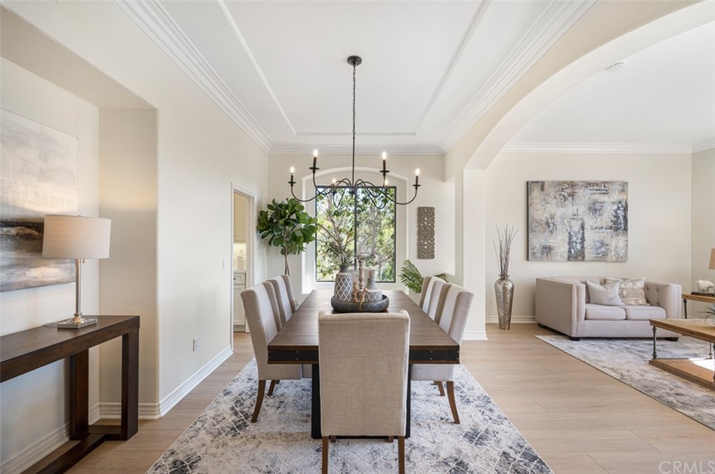3724 Cedar Vale Way Fallbrook, CA 92028 - Photo 4 of 39 a dining room with furniture a chandelier and window