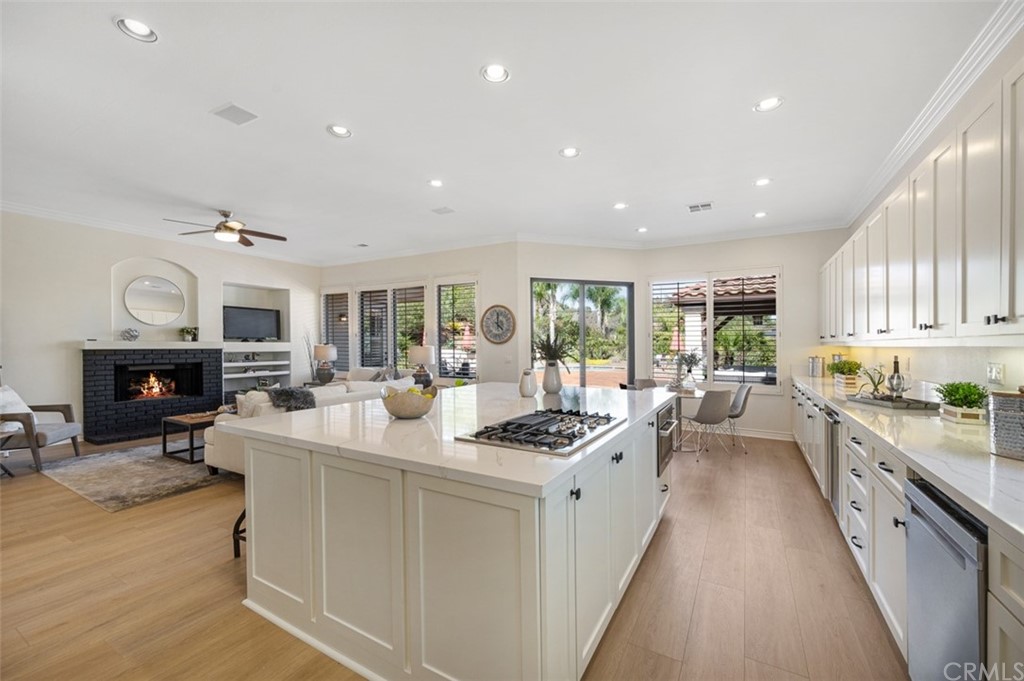 3724 Cedar Vale Way Fallbrook, CA 92028 - Photo 7 of 39 a large white kitchen with stainless steel appliances granite countertop a stove and a large window
