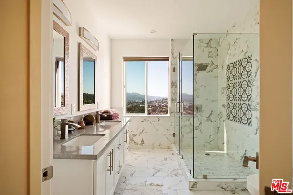 a bathroom with a sink and a large mirror