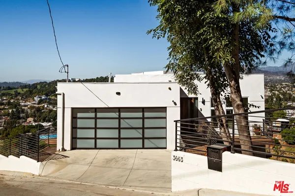 a front view of a house with garage