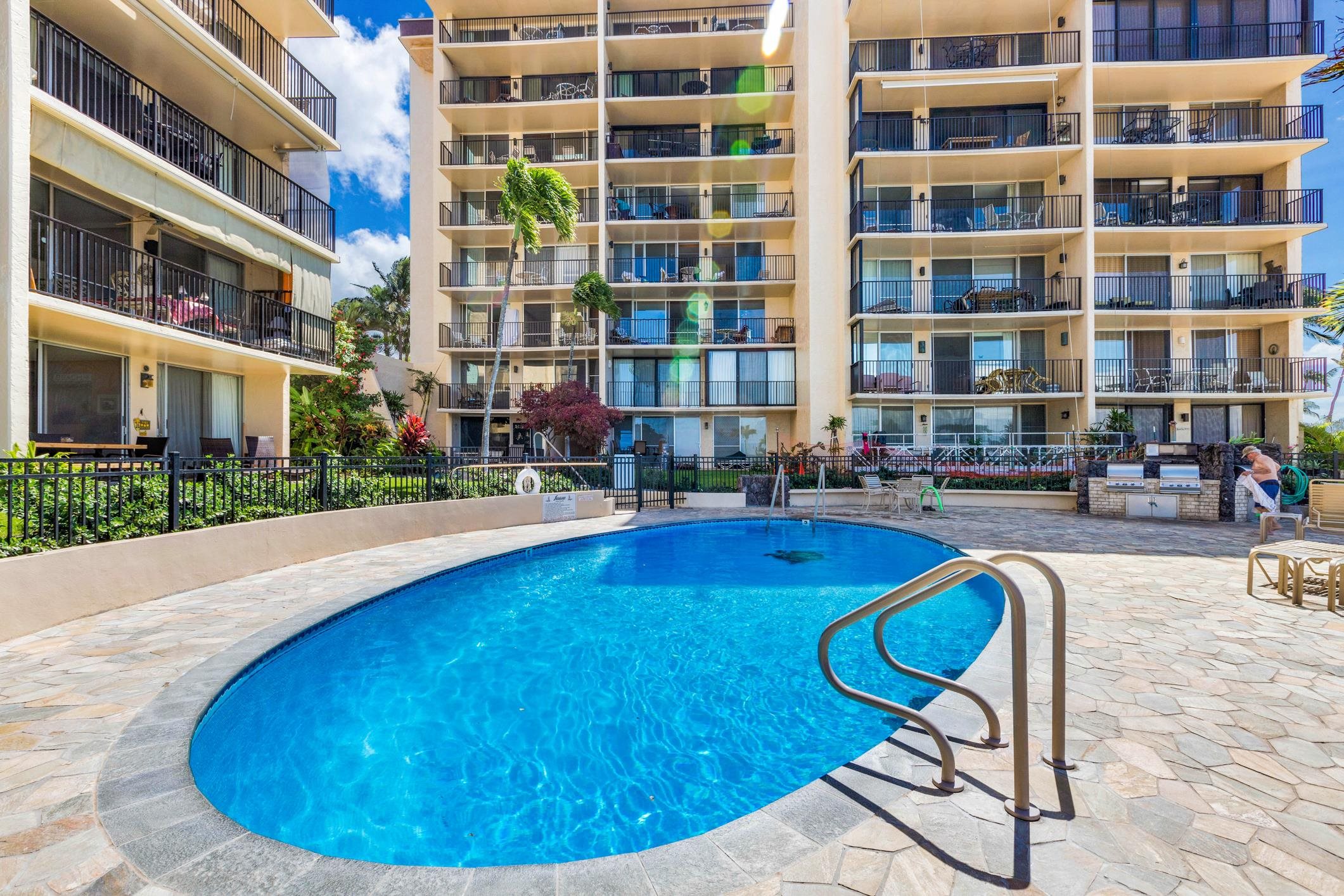 4401 Lower Honoapiilani Road, Unit A103 Lahaina, HI 96761 - Photo 14 of 45 a swimming pool with outdoor seating