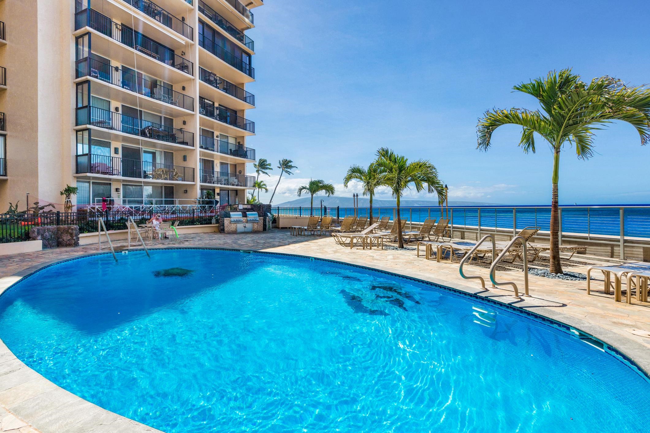 4401 Lower Honoapiilani Road, Unit A103 Lahaina, HI 96761 - Photo 15 of 45 a view of swimming pool with outdoor seating and potted plants