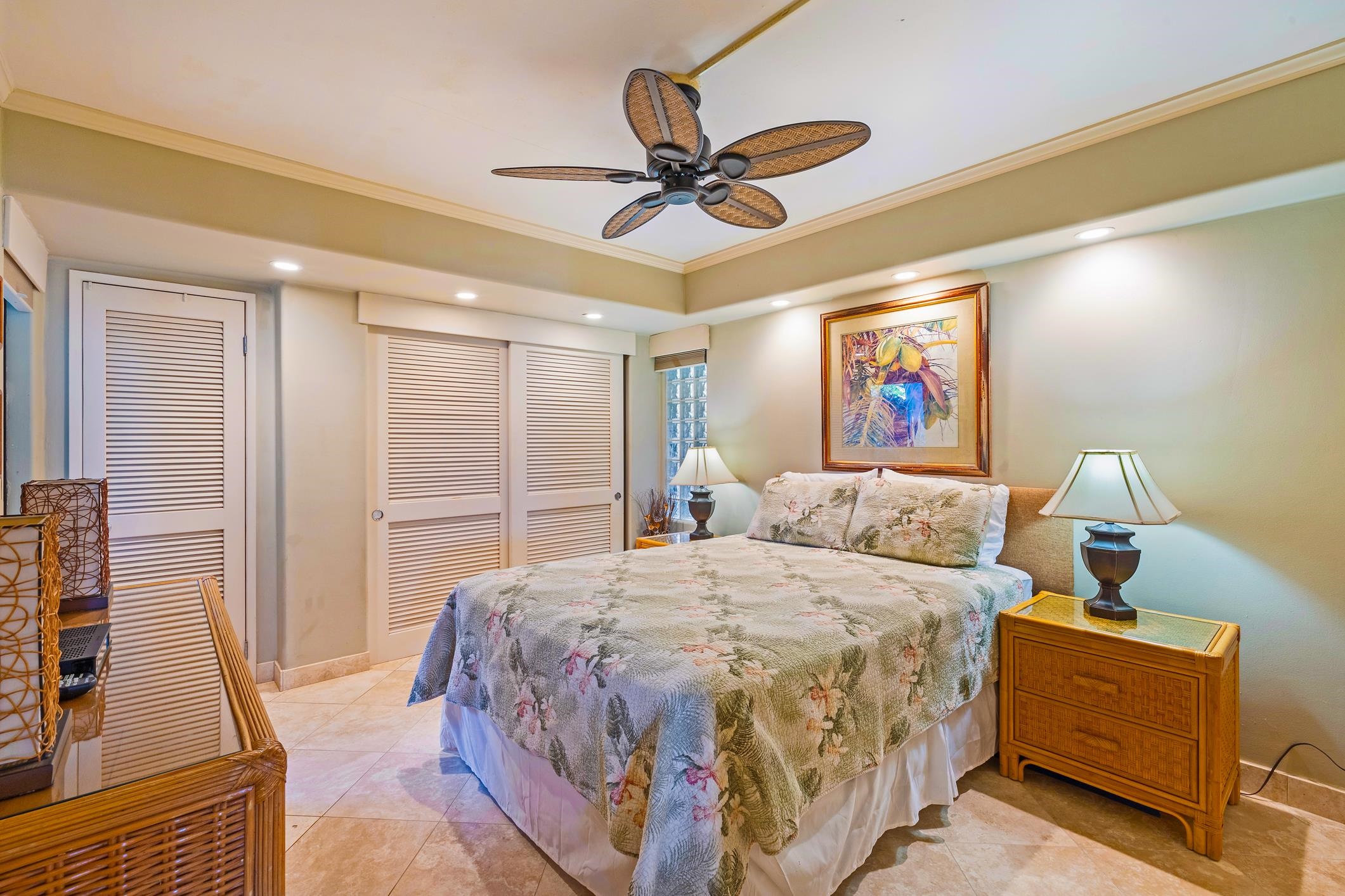 4401 Lower Honoapiilani Road, Unit A103 Lahaina, HI 96761 - Photo 45 of 45 a bedroom with a bed and a chandelier