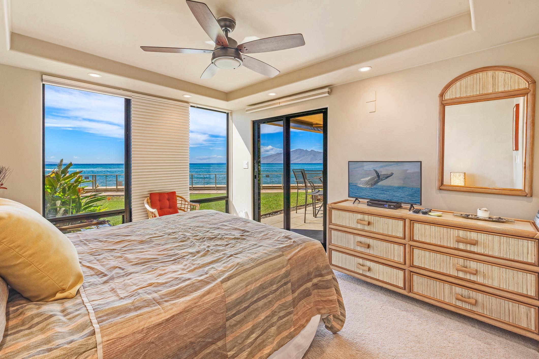 4401 Lower Honoapiilani Road, Unit A103 Lahaina, HI 96761 - Photo 8 of 45 a bedroom with a bed and a dresser