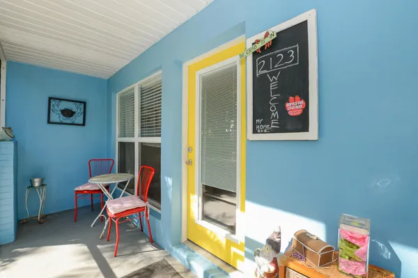 a room with furniture and a painting on the wall