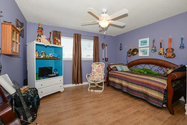 a bedroom with furniture and a window
