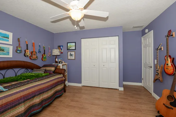 a bedroom with furniture and a baby crib