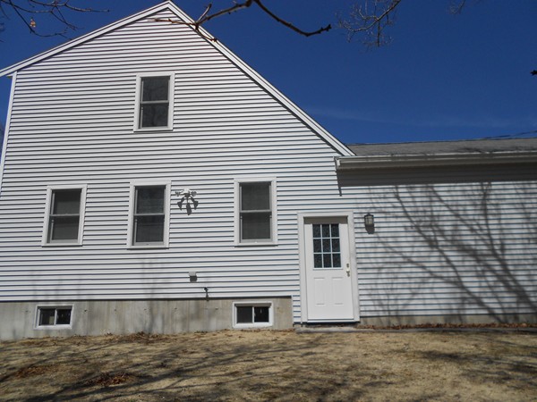 90-90B Waterhouse Road Bourne, MA 02532 - Photo 17 of 19 a view of a house with a yard