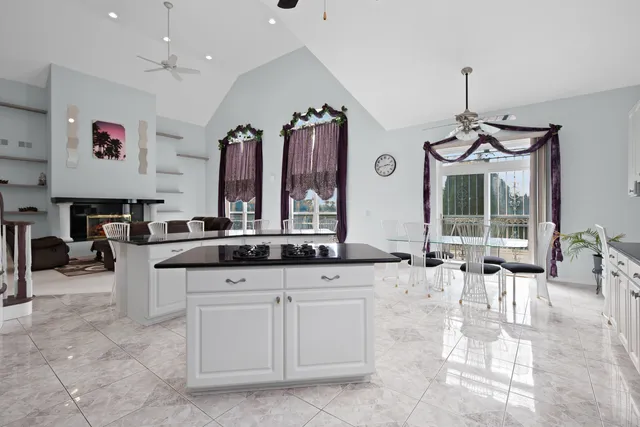 a kitchen with granite countertop a sink and a stove