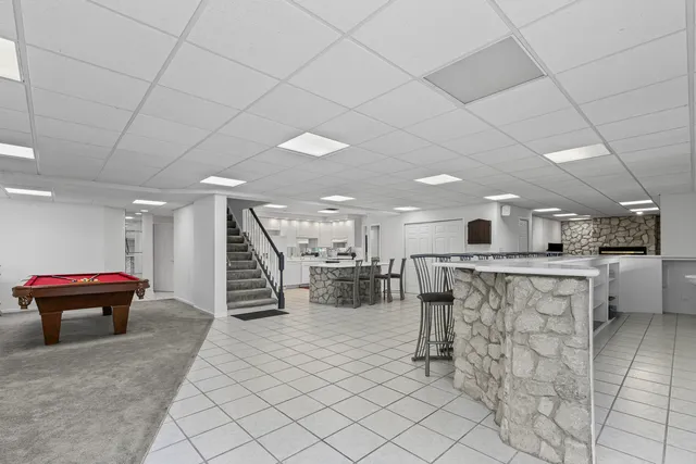 a lobby with furniture and a table