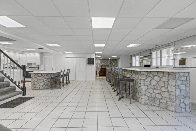 a room with lots of table and chairs