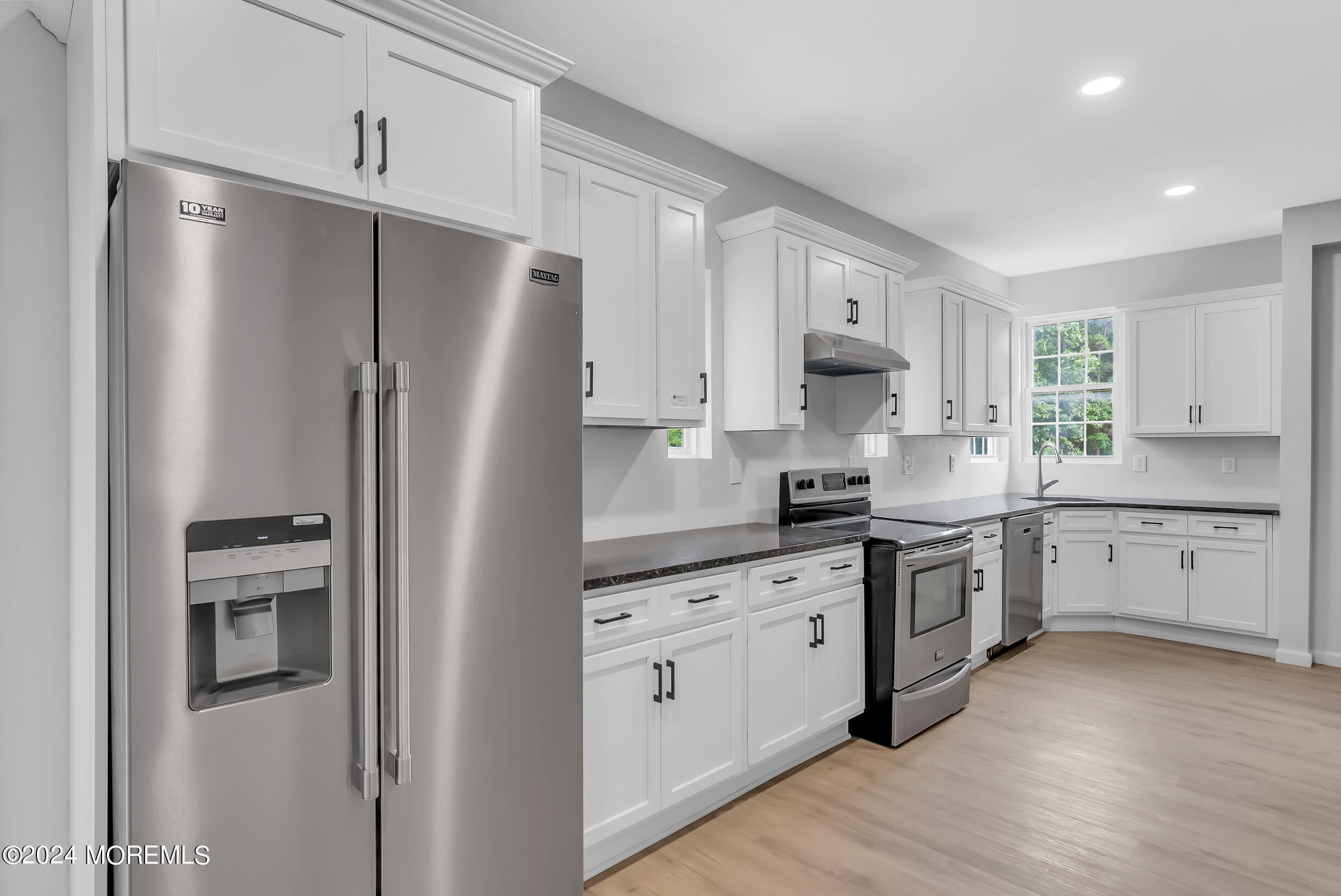 888 Anderson Road Jackson, NJ 08527 - Photo 16 of 81 a kitchen with white cabinets and stainless steel appliances