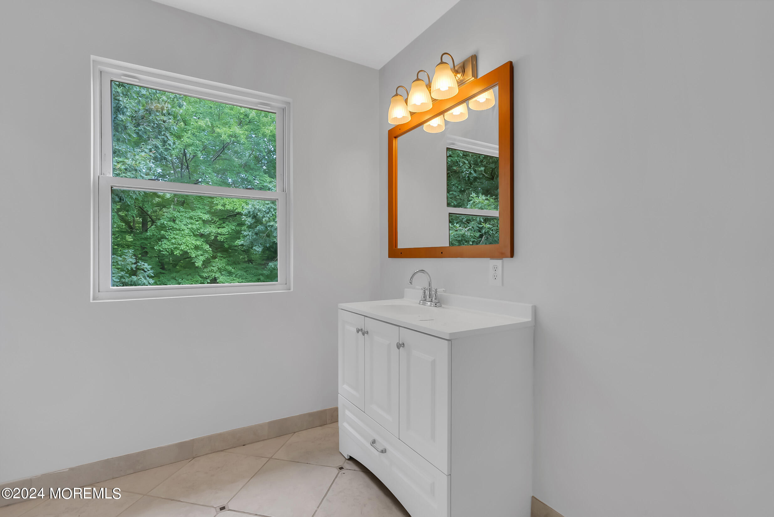 888 Anderson Road Jackson, NJ 08527 - Photo 32 of 81 a bathroom with a sink vanity and a mirror