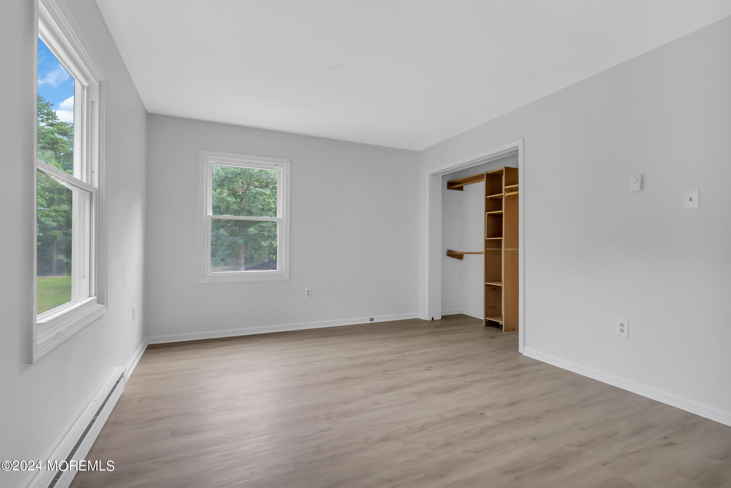 888 Anderson Road Jackson, NJ 08527 - Photo 44 of 81 an empty room with wooden floor and windows