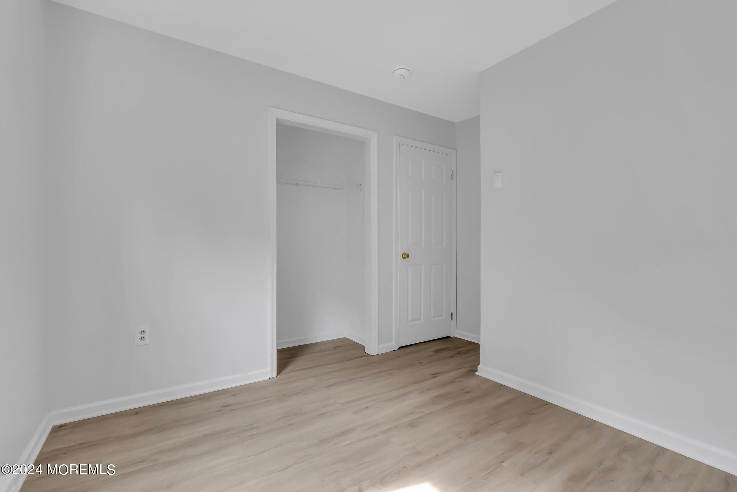 888 Anderson Road Jackson, NJ 08527 - Photo 47 of 81 a view of an empty room with wooden floor