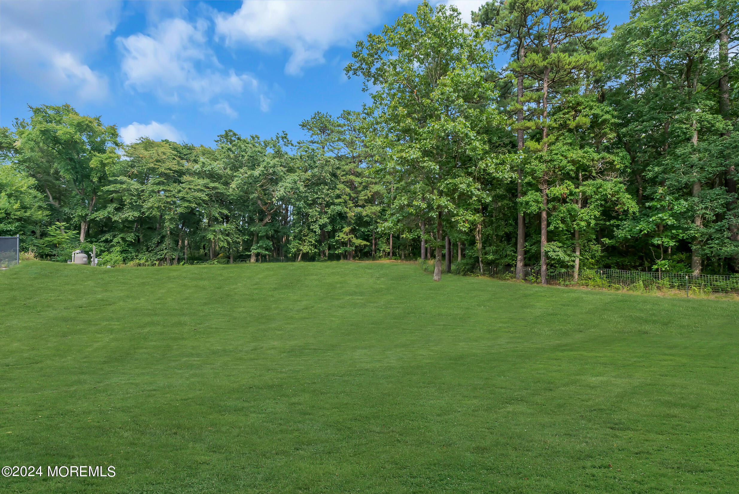 888 Anderson Road Jackson, NJ 08527 - Photo 51 of 81 a view of a green field with wooden fence
