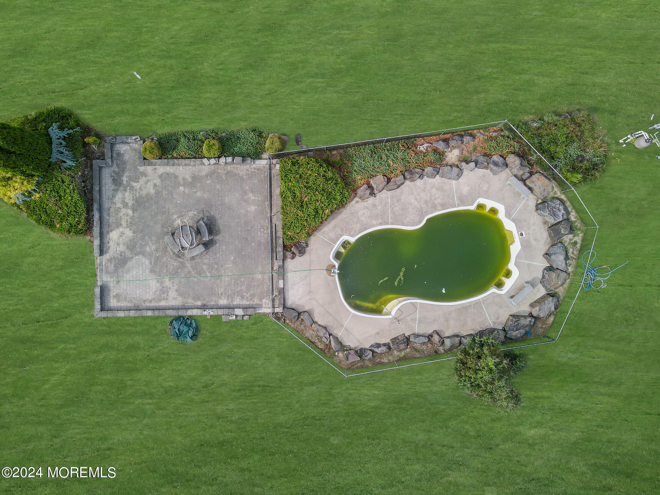 888 Anderson Road Jackson, NJ 08527 - Photo 72 of 81 a view of a swimming pool with a garden and plants