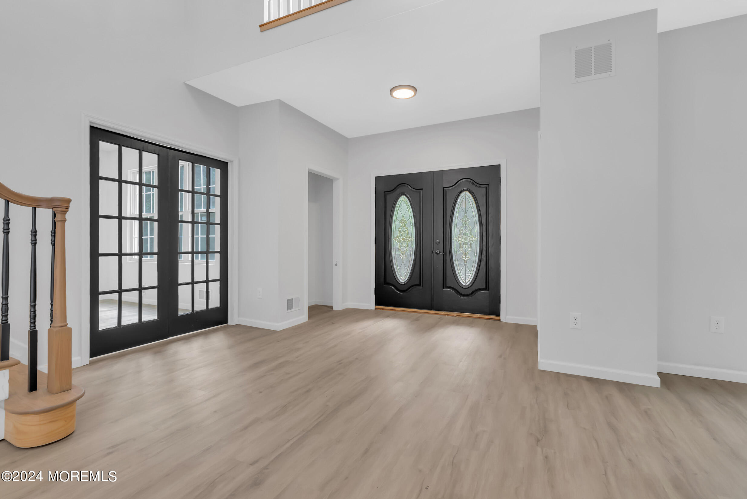 888 Anderson Road Jackson, NJ 08527 - Photo 8 of 81 an empty room with wooden floor and windows