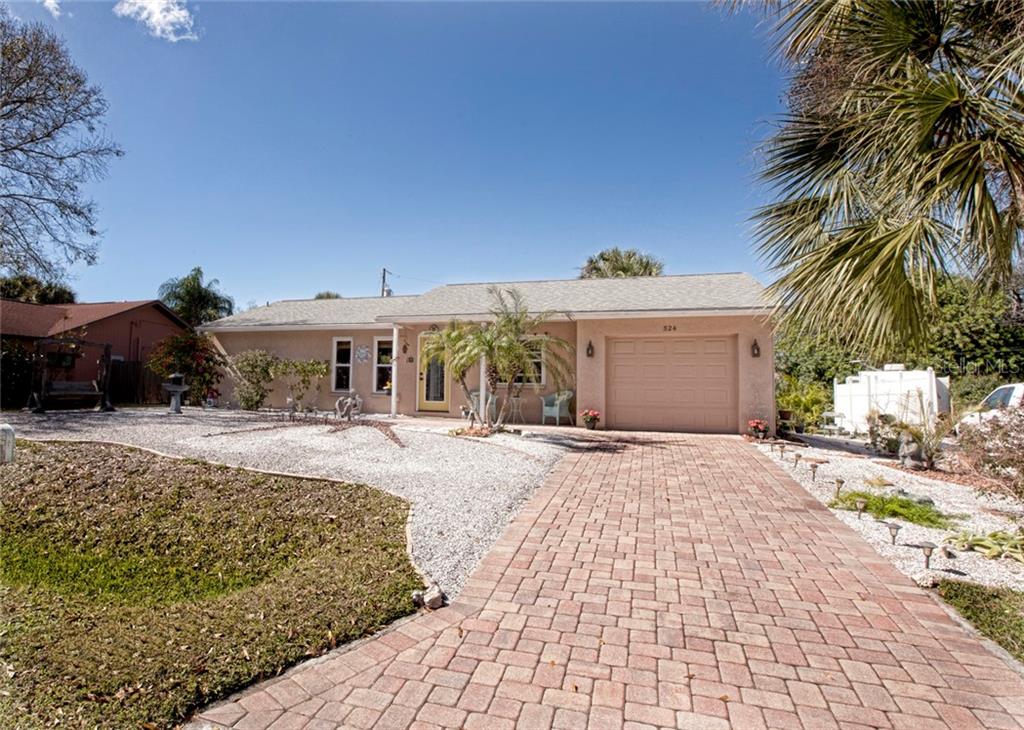 524 Pelican Road Venice, FL 34293 - Photo 1 of 1 a front view of a house with garden