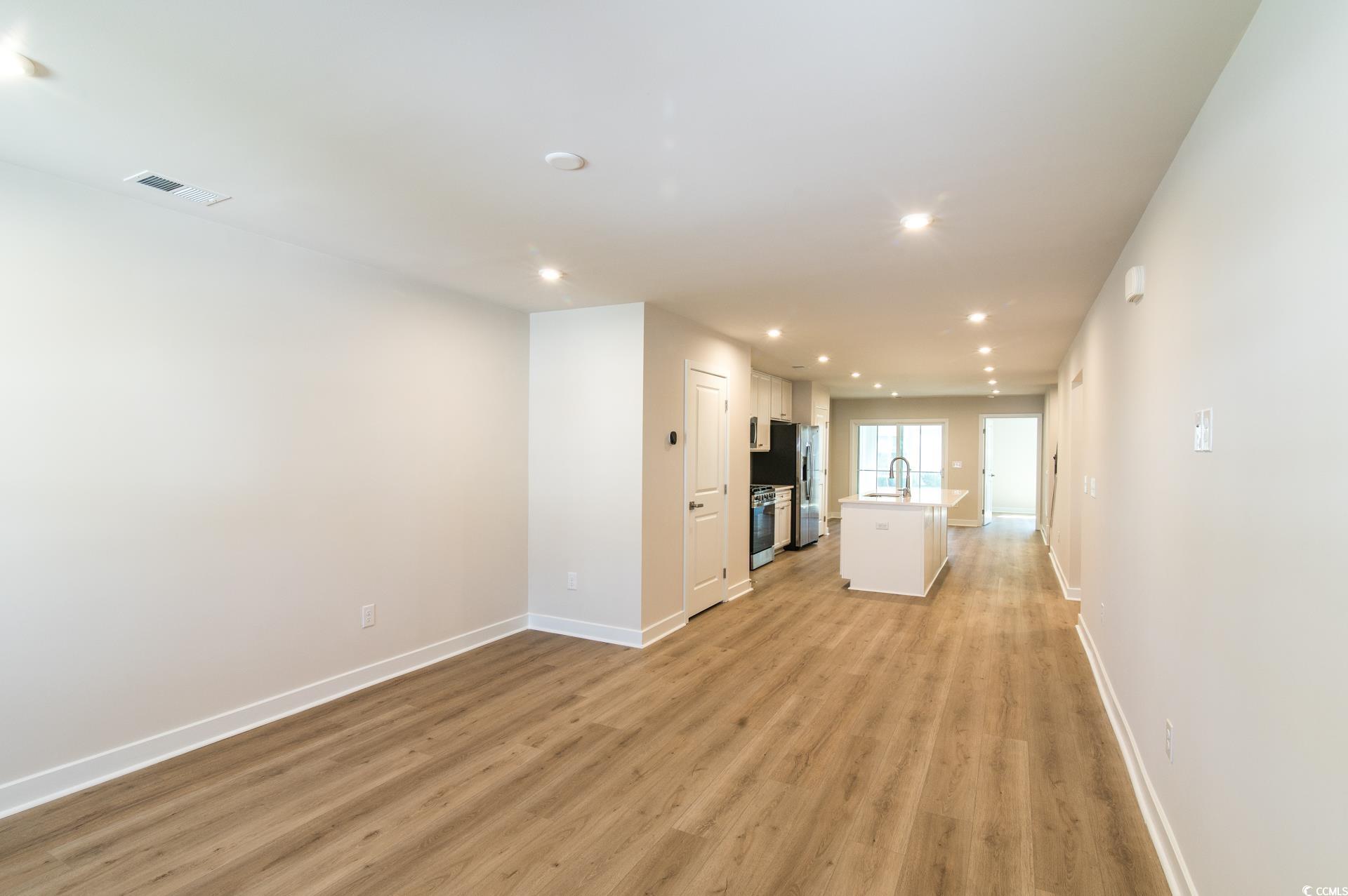 2382 Elowen Lane Longs, SC 29568 - Photo 2 of 36 Unfurnished living room featuring recessed lighting and light wood-style flooring