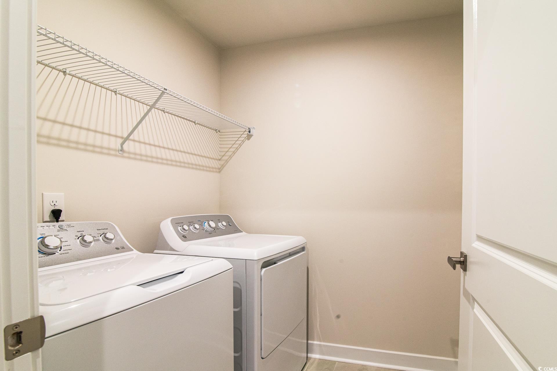 2382 Elowen Lane Longs, SC 29568 - Photo 26 of 36 Laundry room featuring washer and dryer and baseboards
