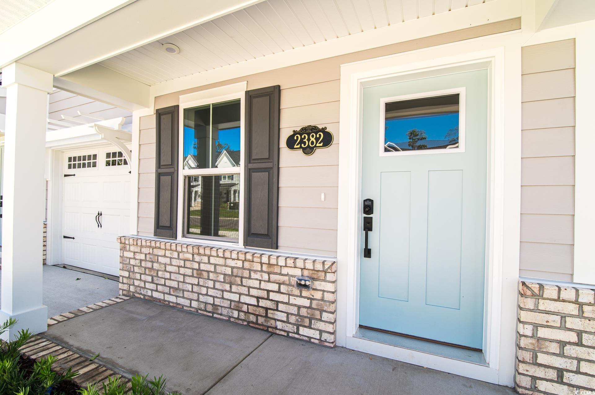 2382 Elowen Lane Longs, SC 29568 - Photo 31 of 36 View of exterior entry with covered porch