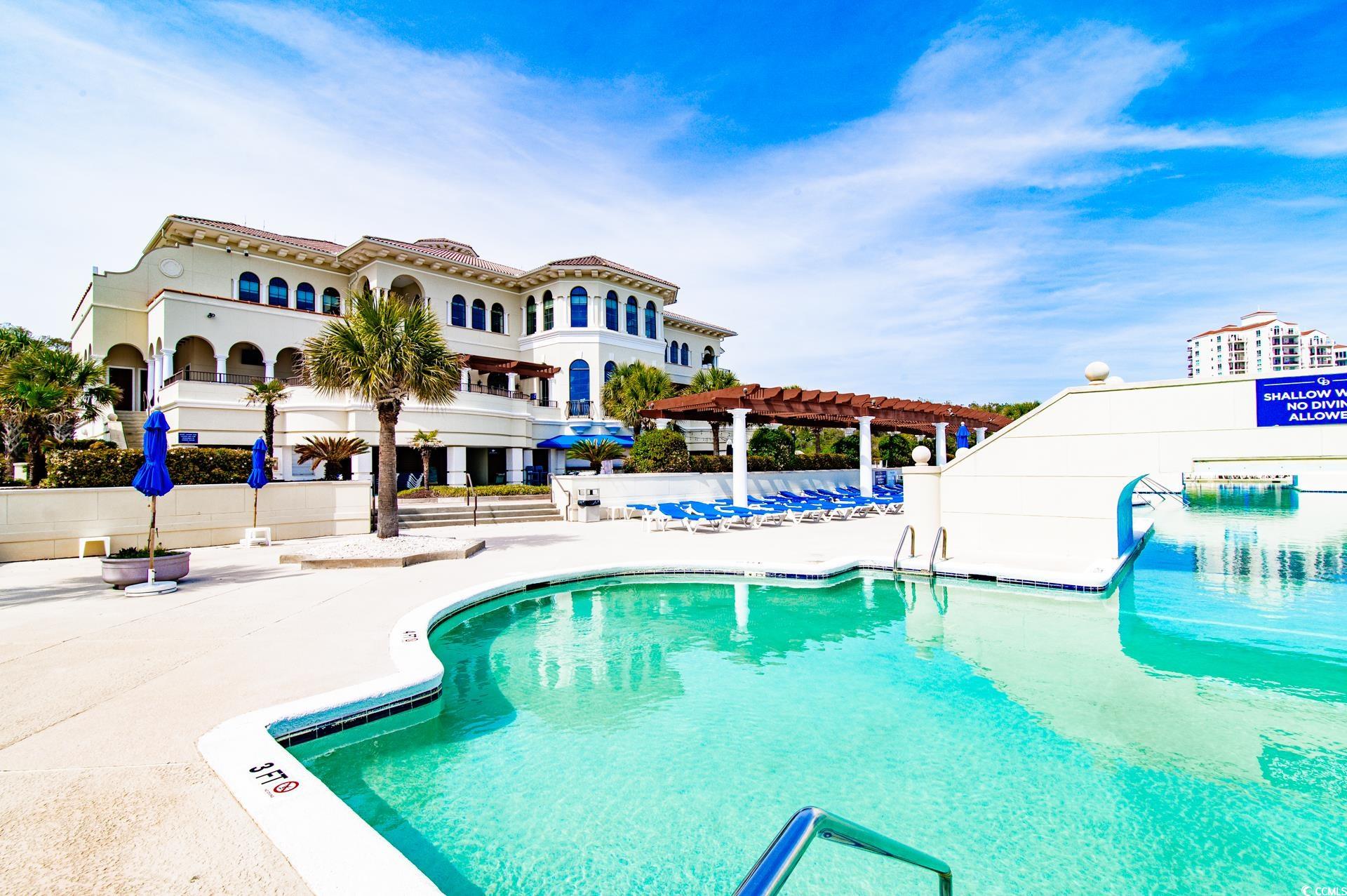 2382 Elowen Lane Longs, SC 29568 - Photo 33 of 36 Community pool featuring a pergola and a patio area