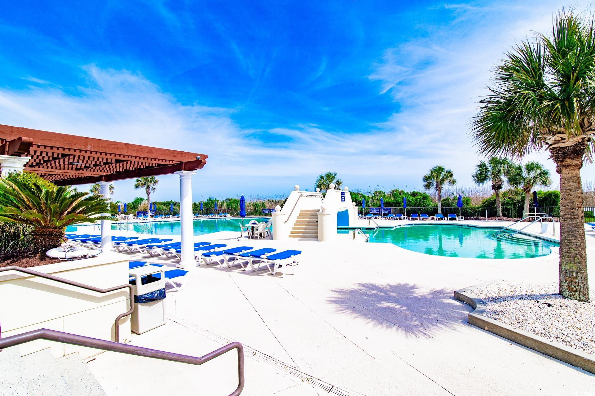 2382 Elowen Lane Longs, SC 29568 - Photo 35 of 36 Community pool with a patio and a pergola