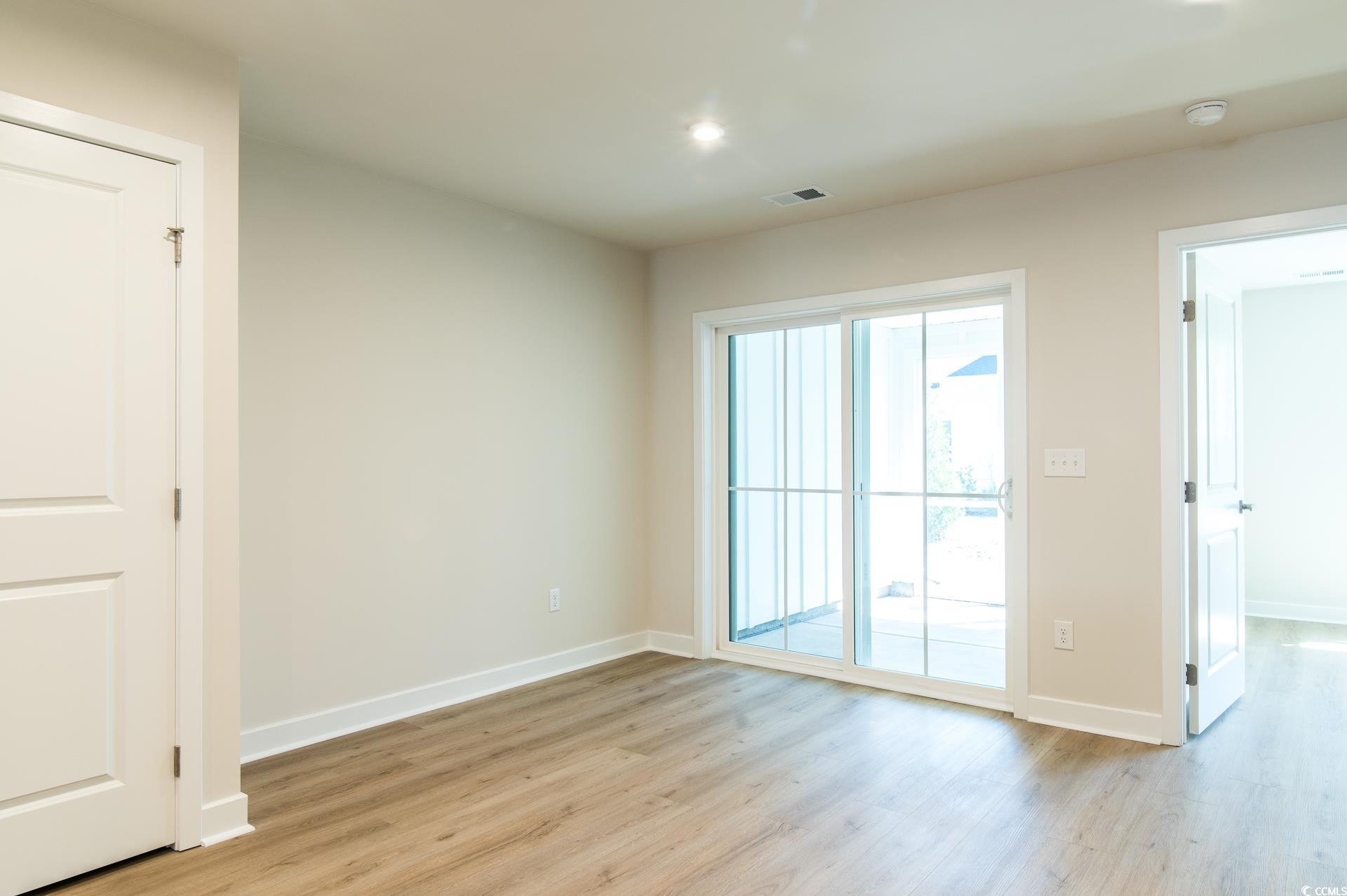 2382 Elowen Lane Longs, SC 29568 - Photo 10 of 36 Unfurnished room featuring light wood-type flooring and recessed lighting