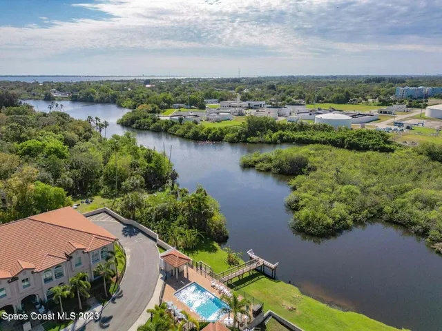 a view of a lake with houses in the back