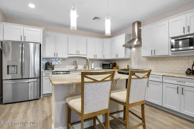 a kitchen with a table and chairs