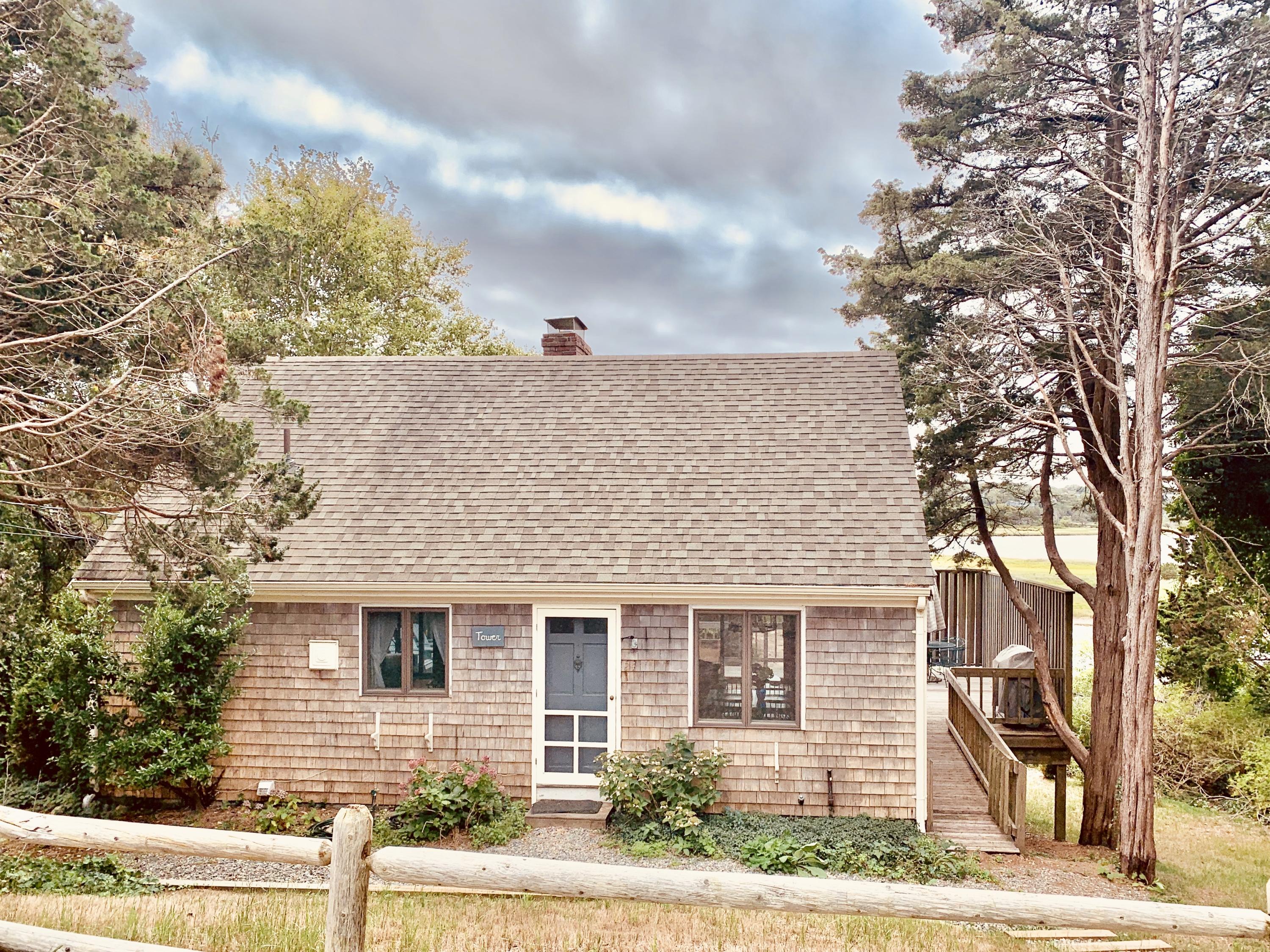 24 Alden Road Orleans, MA 02653 - Photo 1 of 27 a front view of a house with a yard