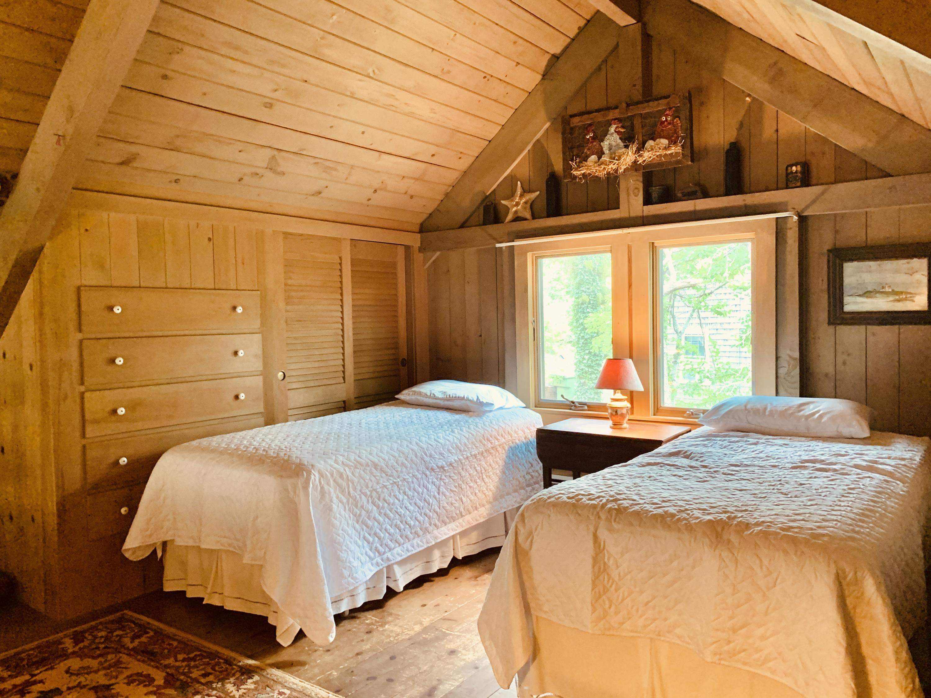 24 Alden Road Orleans, MA 02653 - Photo 13 of 27 a bedroom with two beds and large windows