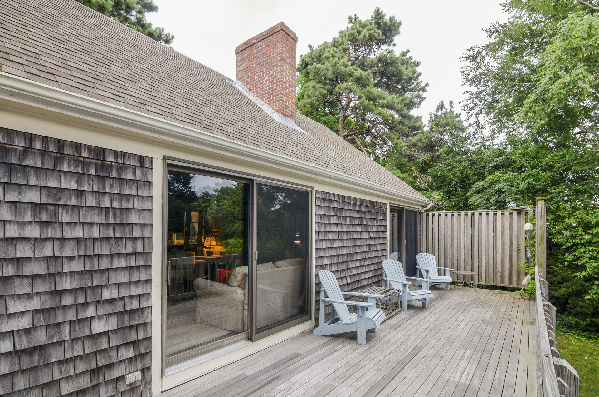 24 Alden Road Orleans, MA 02653 - Photo 20 of 27 a view of a patio with a table and chairs and wooden floor