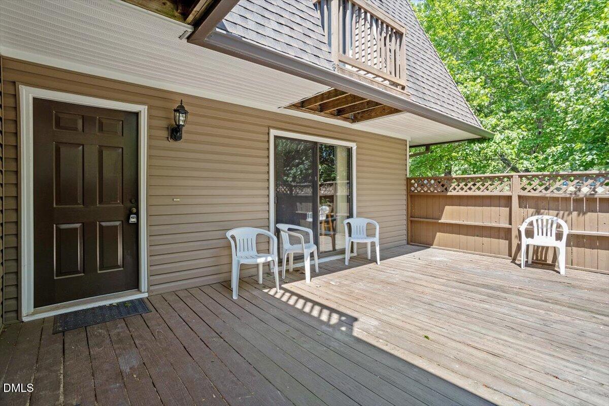 163 Springberry Lane Chapel Hill, NC 27517 - Photo 3 of 32 a roof deck with a table and chairs and wooden floor