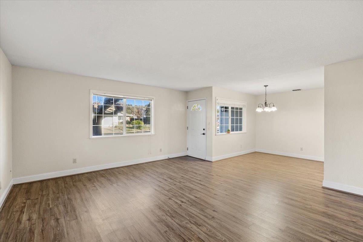 6318 David Avenue Loomis, CA 95650 - Photo 11 of 26 an empty room with wooden floor and windows