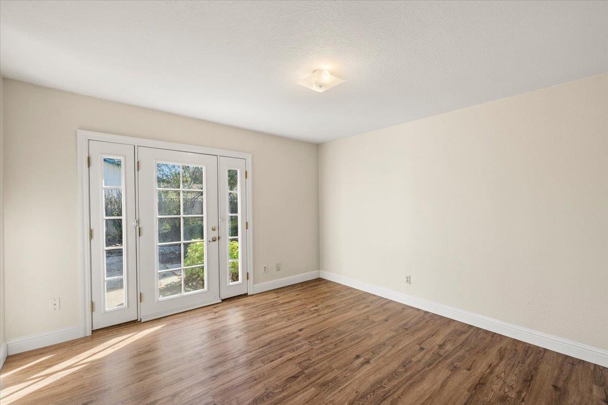 6318 David Avenue Loomis, CA 95650 - Photo 16 of 26 an empty room with wooden floor and windows