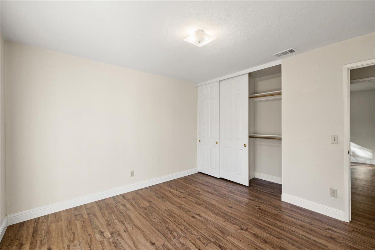 6318 David Avenue Loomis, CA 95650 - Photo 17 of 26 a view of an empty room with wooden floor