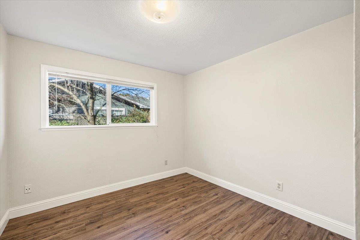 6318 David Avenue Loomis, CA 95650 - Photo 22 of 26 an empty room with wooden floor and window