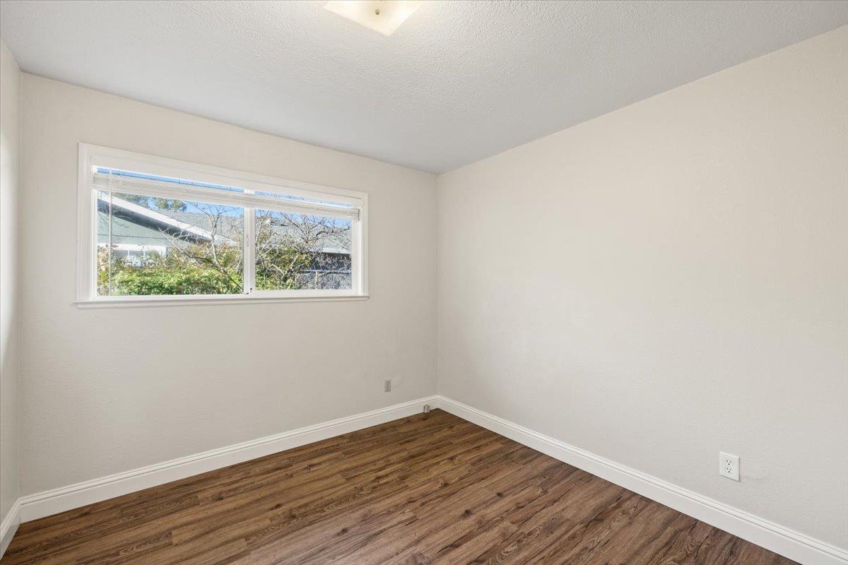 6318 David Avenue Loomis, CA 95650 - Photo 24 of 26 a view of an empty room with wooden floor and a window