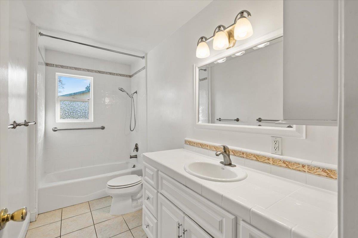 6318 David Avenue Loomis, CA 95650 - Photo 26 of 26 a bathroom with a sink double vanity granite toilet tub and shower