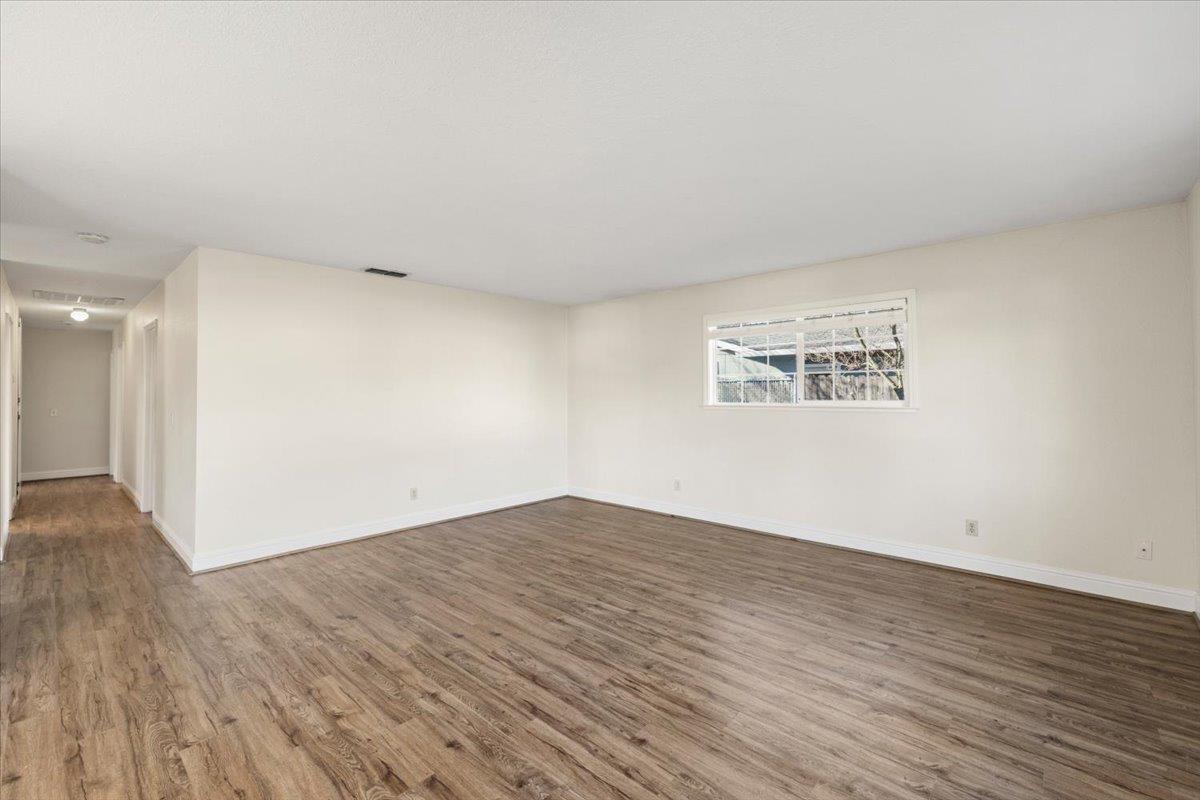6318 David Avenue Loomis, CA 95650 - Photo 9 of 26 a view of an empty room with wooden floor