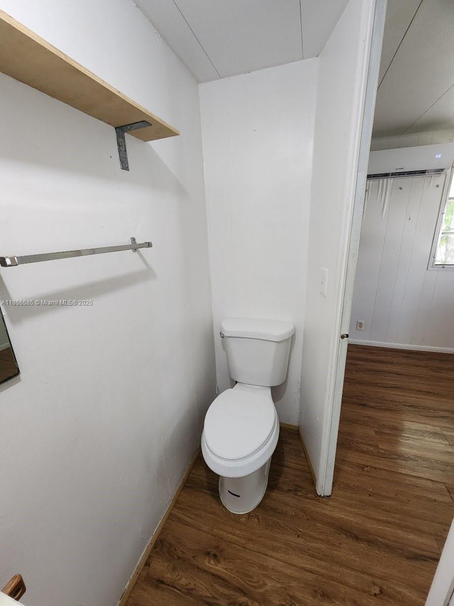 1590 Southwest 65th Terrace, Unit H Boca Raton, FL 33428 - Photo 12 of 17 a white toilet sitting next to a shower