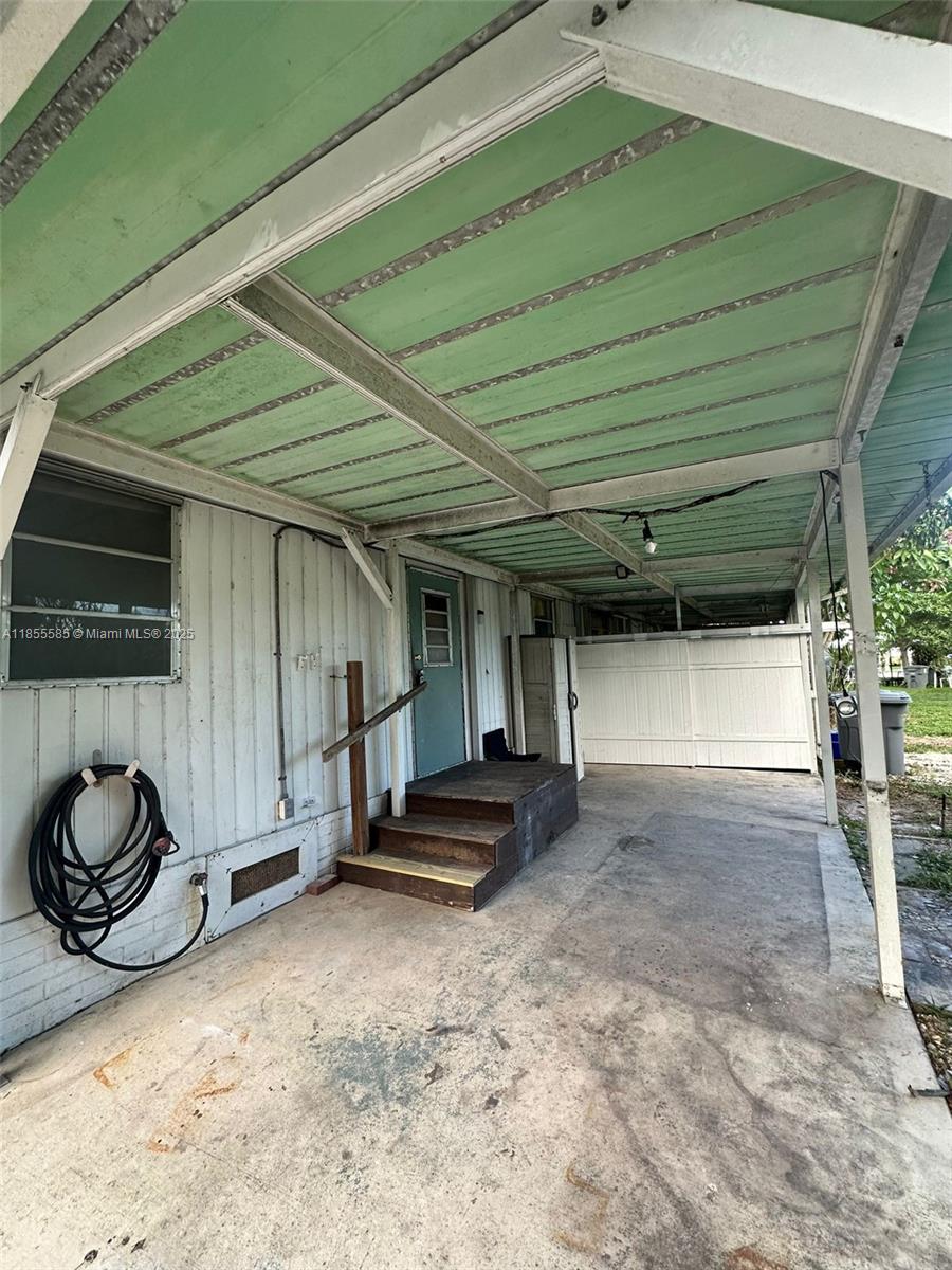 1590 Southwest 65th Terrace, Unit H Boca Raton, FL 33428 - Photo 17 of 17 a view of a back yard of the house