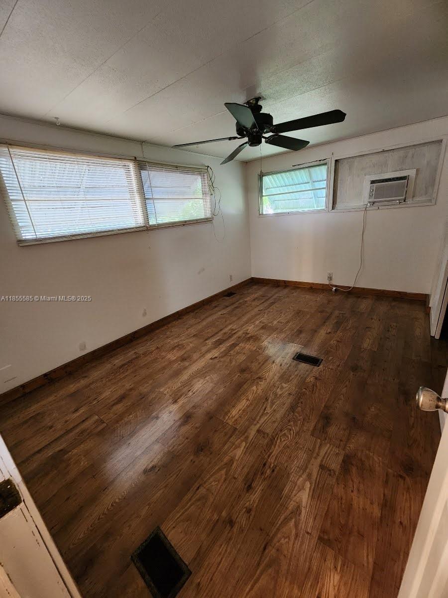 1590 Southwest 65th Terrace, Unit H Boca Raton, FL 33428 - Photo 8 of 17 a view of an empty room and window