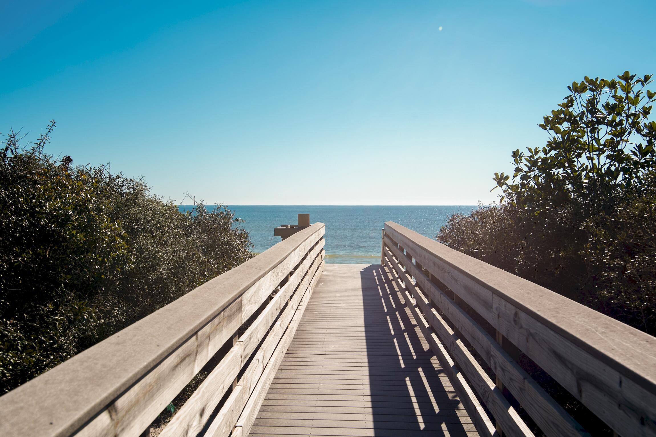 58 Gulf Cove Court Santa Rosa Beach, FL 32459 - Photo 23 of 29 a view of balcony with wooden floor and fence