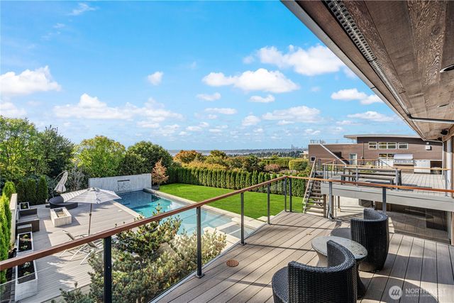a view of a balcony with chairs