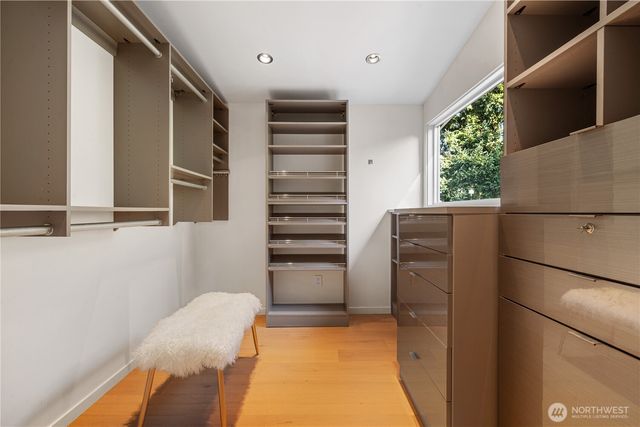 a view of kitchen and wooden cabinets
