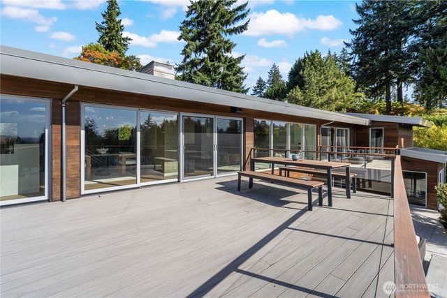a view of a house with pool and wooden floor